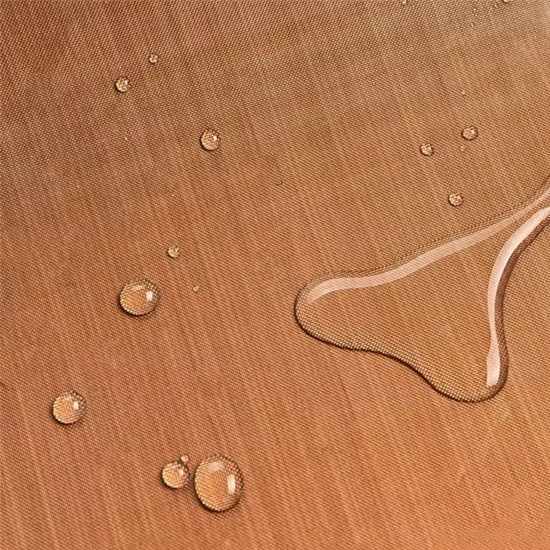 Close view of the woven PTFE-coated fiberglass surface with water droplets