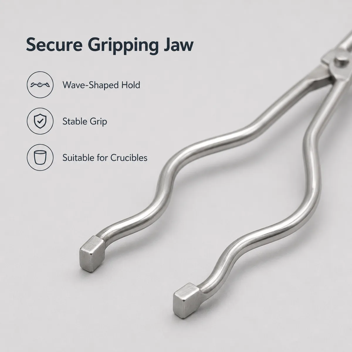 Polished stainless steel handle and hinge detail of crucible tongs