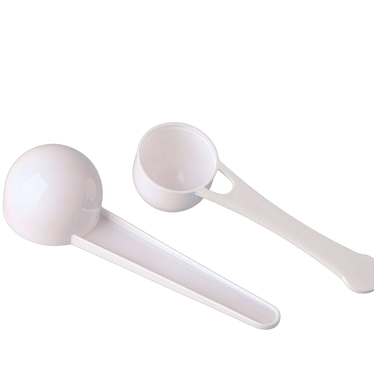 Close view of three white plastic scoop bowl shapes
