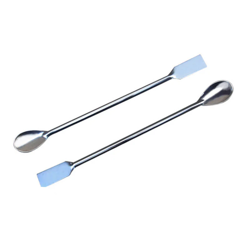 Laboratory sampling scoop on white background