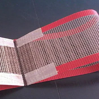 Close product photograph of open-mesh conveyor belting with red edge bands and reinforced end-connection areas